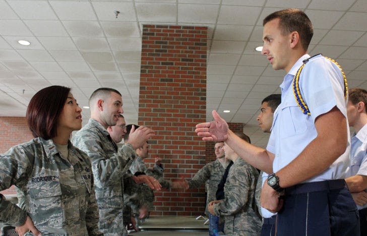 Garret Smith, a 20-year-old UF sports management sophomore at Santa Fe College, talks to Air Force 2nd Lt. Yunji Rodriguez during the UF Air Force ROTC Detachment’s Career Day on Thursday afternoon.&nbsp;