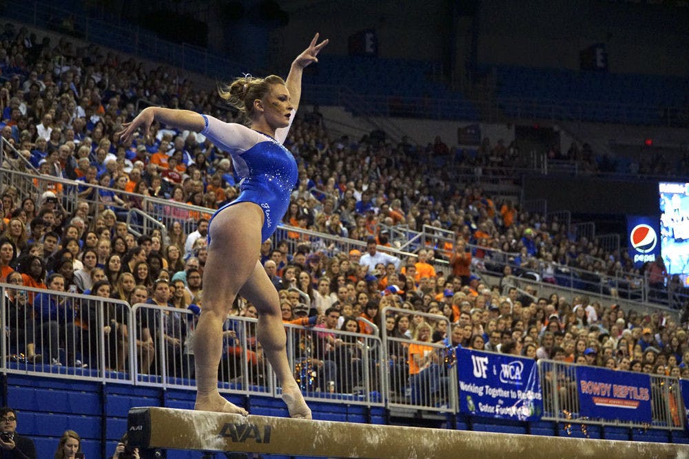 <p>Bridget Sloan performs on the balance beam during Florida's 197.675 to 196.925 over UCLA on Jan. 15, 2016 in the O'Connell Center.&nbsp;</p>