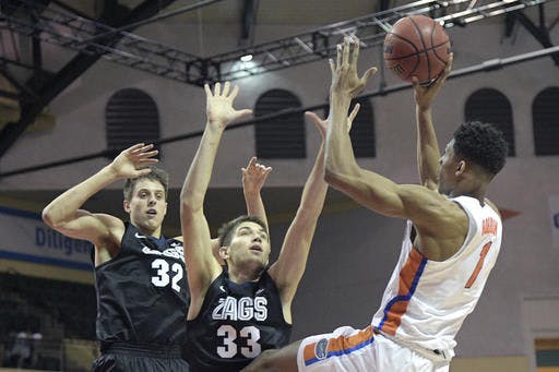 Florida forward Devin Robinson (1) goes up for a shot in front of Gonzaga forward Zach Collins (32) and forward Killian Tillie (33) during the second half of an NCAA college basketball game in Lake Buena Vista, Fla., Friday, Nov. 25, 2016. Gonzaga won 77-72.&nbsp;