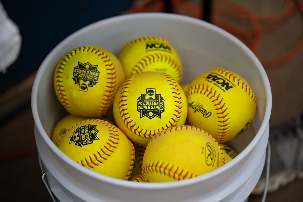 A bucket of softballs with the WCWS logo sit before the first game of the NCAA Women’s College World Series vs. the Texas Longhorns on Thursday, May 29, 2025, at Devon Park in Oklahoma City, Oklahoma.