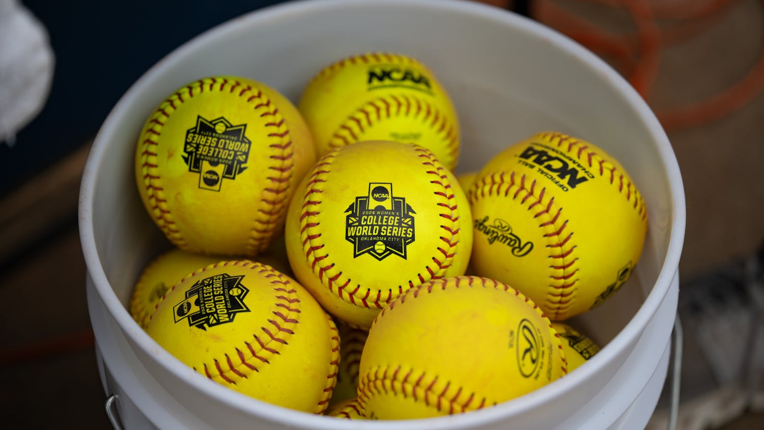 A bucket of softballs with the WCWS logo sit before the first game of the NCAA Women’s College World Series vs. the Texas Longhorns on Thursday, May 29, 2025, at Devon Park in Oklahoma City, Oklahoma.