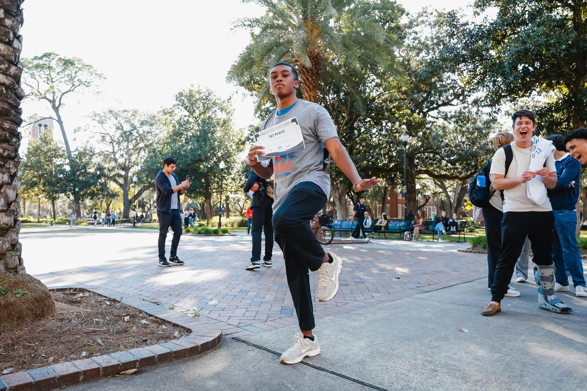 UF student Sam Ero hits the &quot;Heisman pose&quot; after winning first place at the DJ Lagway Look-Alike contest in Plaza of the Americas on Friday, January 17, 2025.