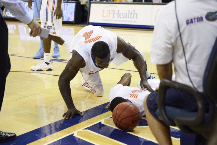 Kasey Hill lies on the ground after suffering an ankle injury during the second half of Florida’s 67-53 victory against Southern in the O’Connell Center on Monday. Hill is expected to miss at least one month due to a high ankle sprain.