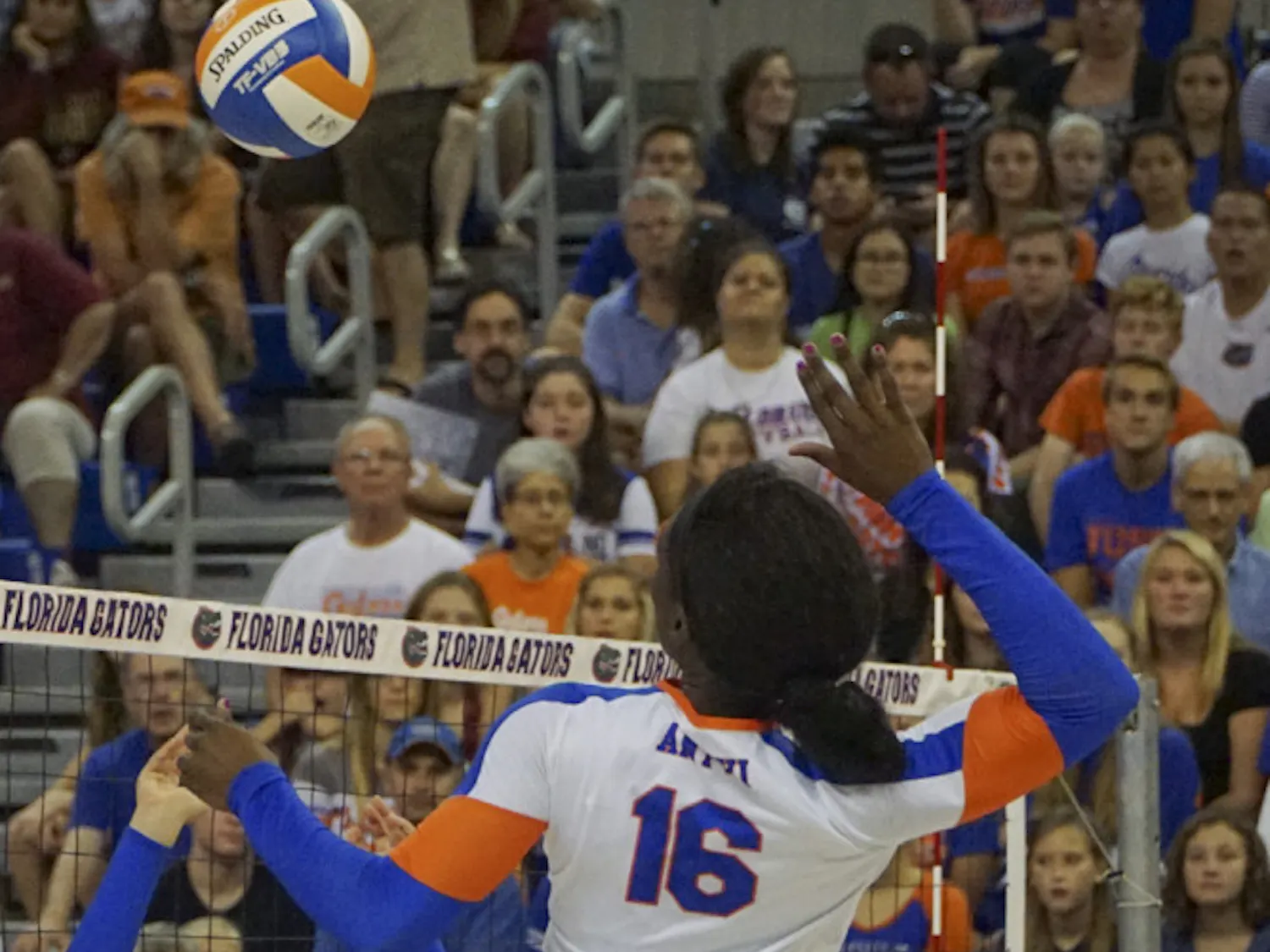 UF setter Mackenzie Dagostino sets the ball for middle blocker Simone Antwi during Florida's 3-1 win against Florida State on Sept. 20, 2015, in the O'Connell Center.