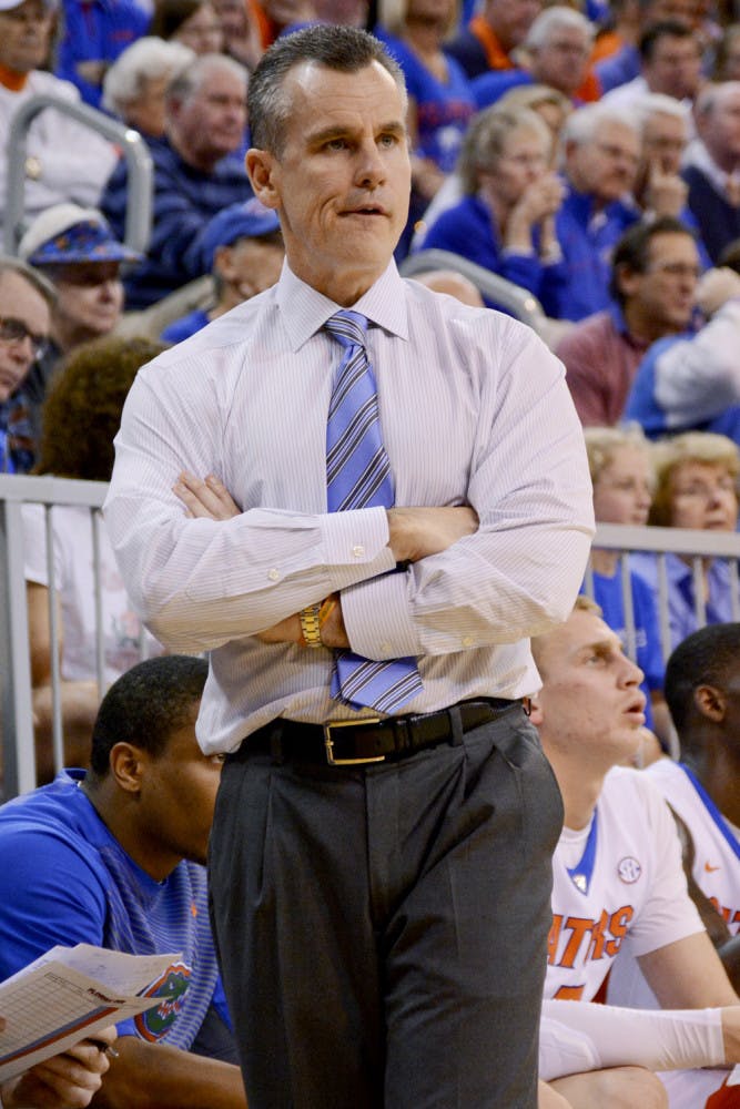 Billy Donovan looks down the court during Florida's 57-56 win against Arkansas on Saturday in the O'Connell Center.