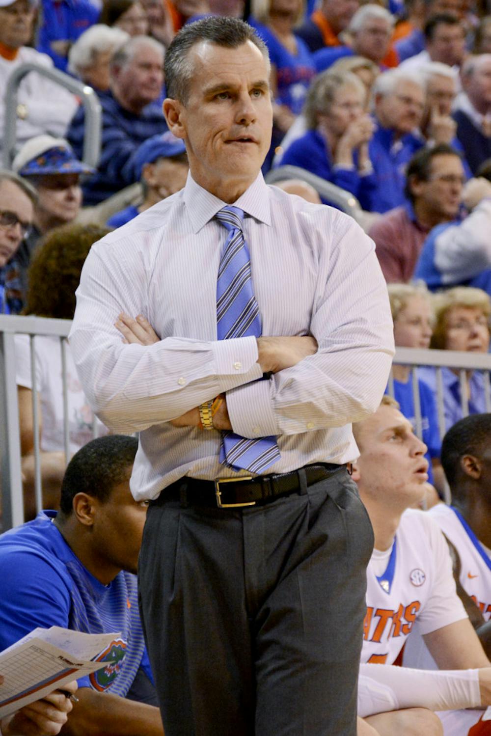 <p>Billy Donovan looks down the court during Florida's 57-56 win against Arkansas on Saturday in the O'Connell Center.</p>