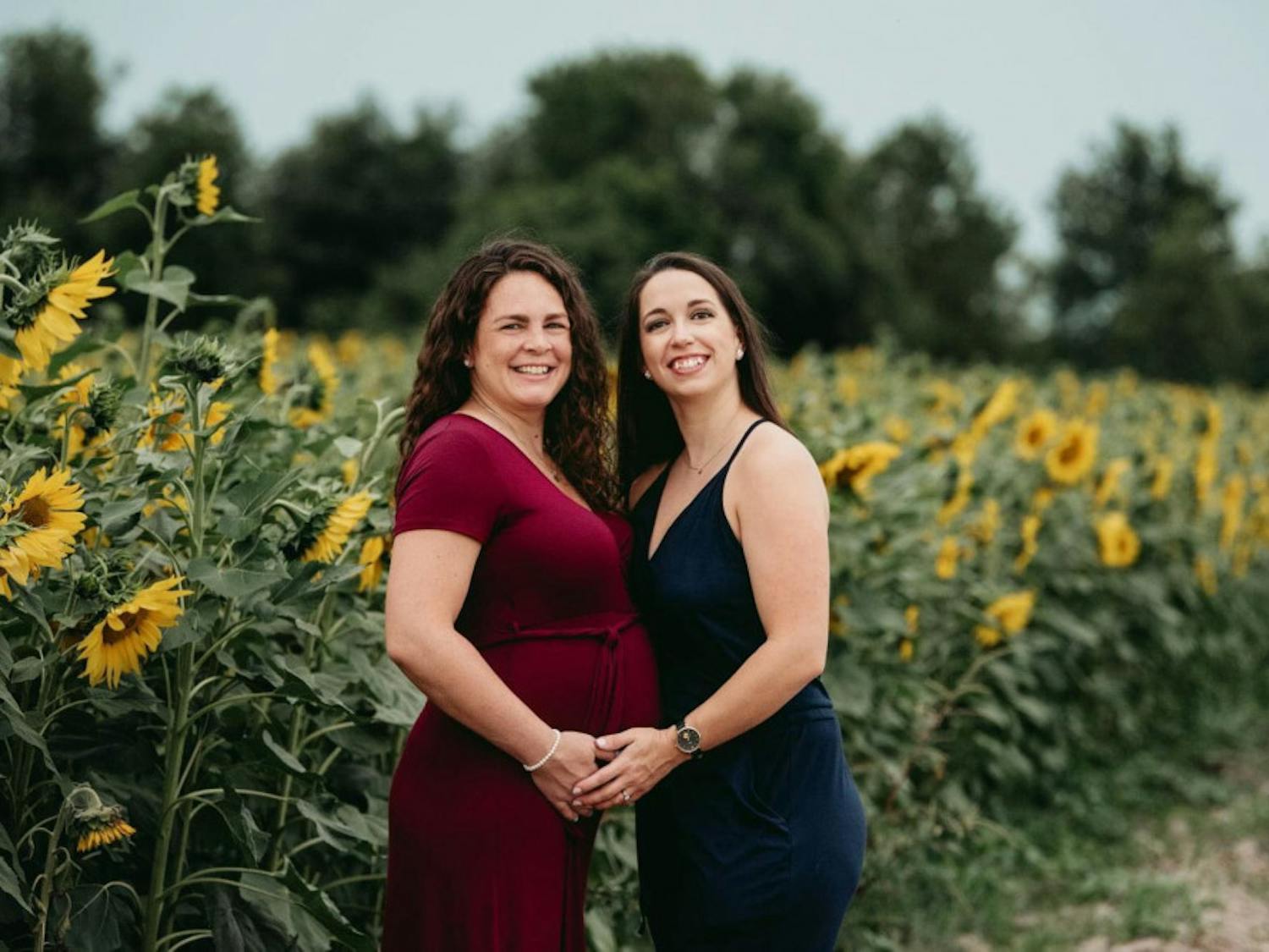 Adrianna and Ashley Tousignant celebrate their pregnancy in a field of sunflowers. Their baby boy was born June 19.&nbsp;
