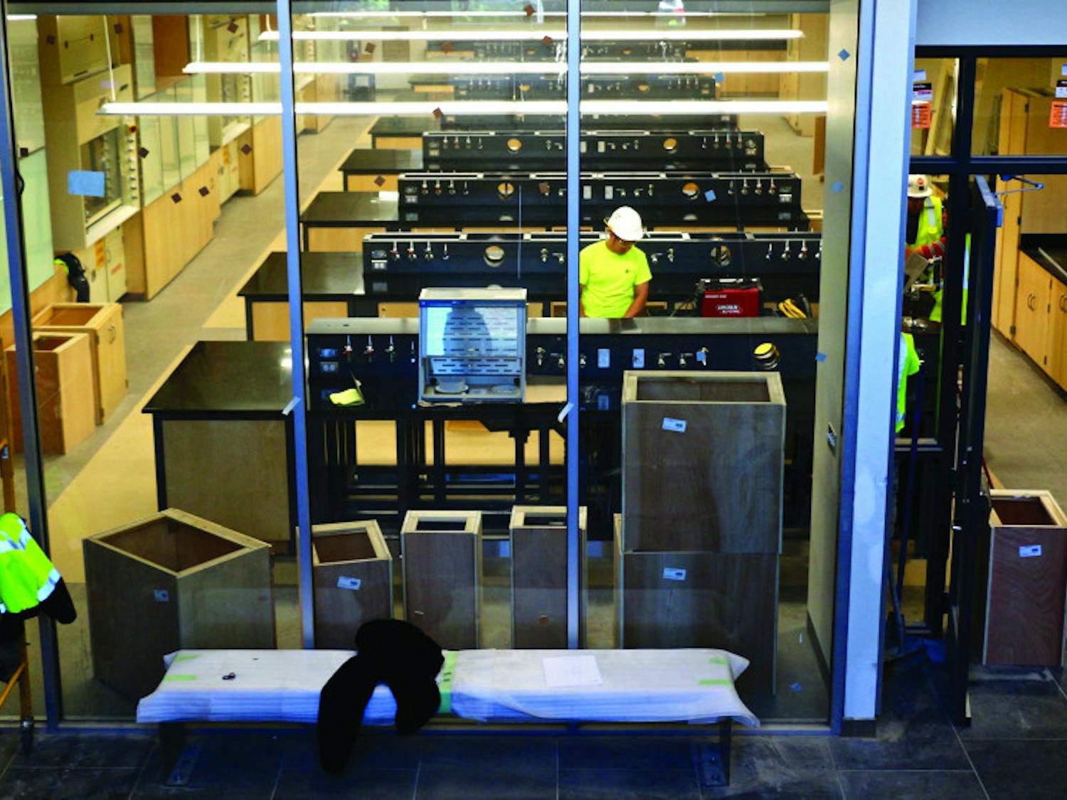 A view of the general chemistry lab from the stairs located perpendicular to them. The new general chemistry lab located on the first floor has 16 stations with the intent of accommodating 16 students per station for an estimated occupancy of 250.