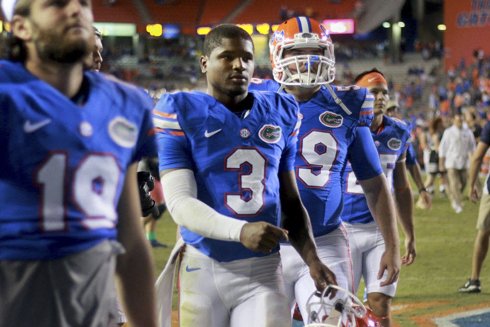 Freshman quarterback Treon Harris walks off the field following Florida's 42-13 loss to Missouri on Saturday at Ben Hill Griffin Stadium.