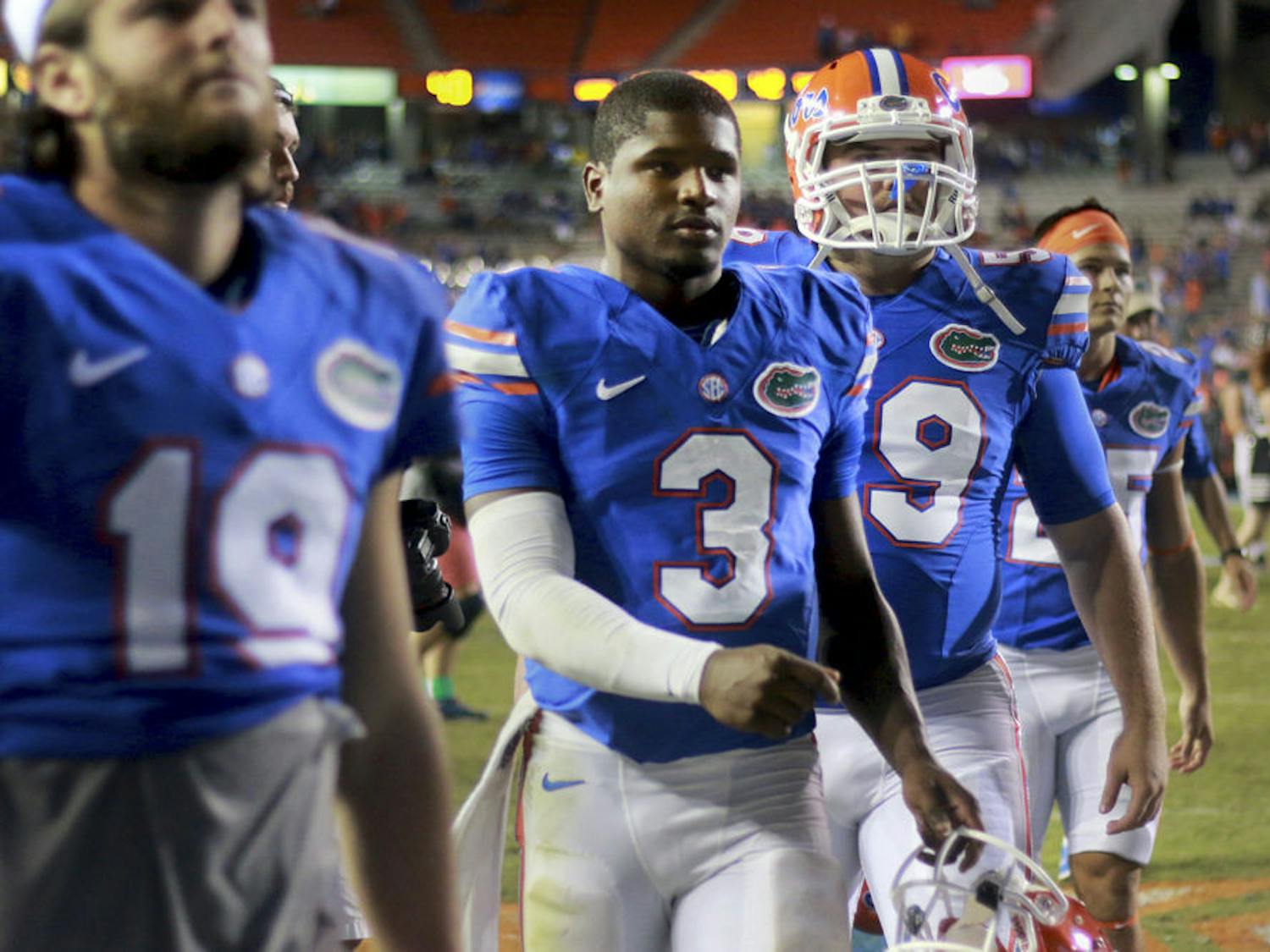 Freshman quarterback Treon Harris walks off the field following Florida's 42-13 loss to Missouri on Saturday at Ben Hill Griffin Stadium.