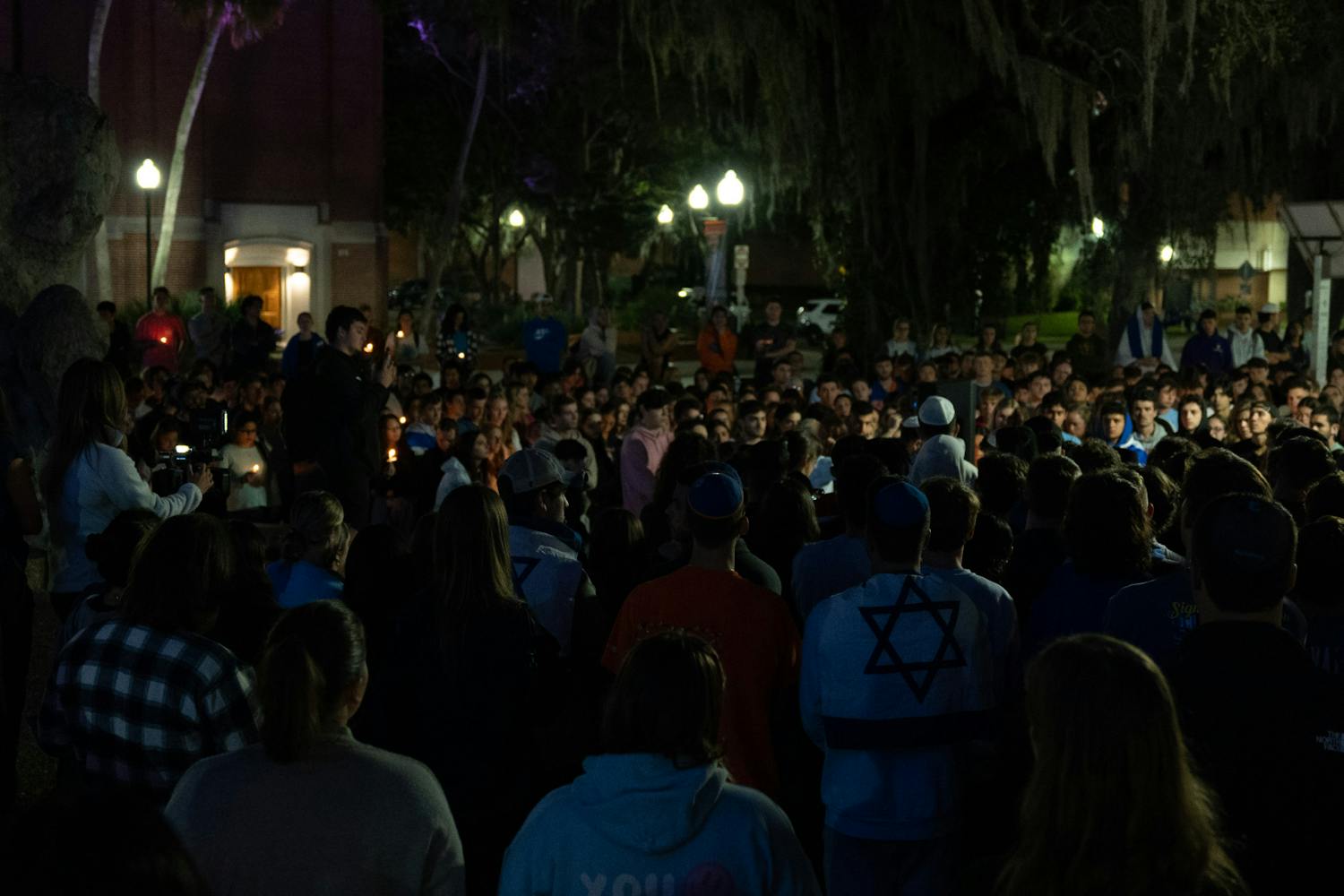 Hundreds of UF students and community members gather in Turlington Plaza for a candlelight vigil to show support for Israel after after Palestinian militant groups led by Hamas launched a large-scale invasion on Monday, Oct. 10, 2023. 