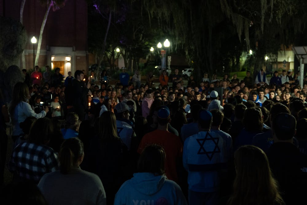 <p>Hundreds of UF students and community members gather in Turlington Plaza for a candlelight vigil to show support for Israel after after Palestinian militant groups led by Hamas launched a large-scale invasion on Monday, Oct. 10, 2023. </p>