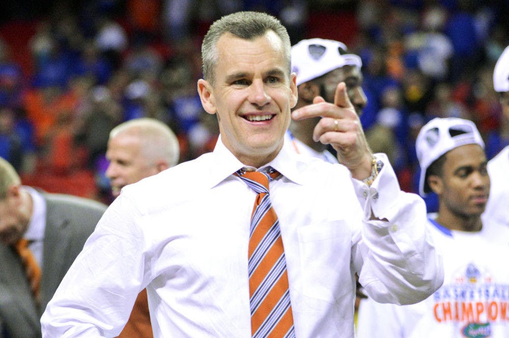 <p>UF men’s basketball coach Billy Donovan points out to the crowd after winning the 2014 Southeastern Conference Tournament championship in Atlanta. Donovan has won 499 games as a collegiate men’s basketball head coach, with his first win coming on Nov. 26, 1994, during Marshall’s 112-67 win against Bluefield College.</p>
