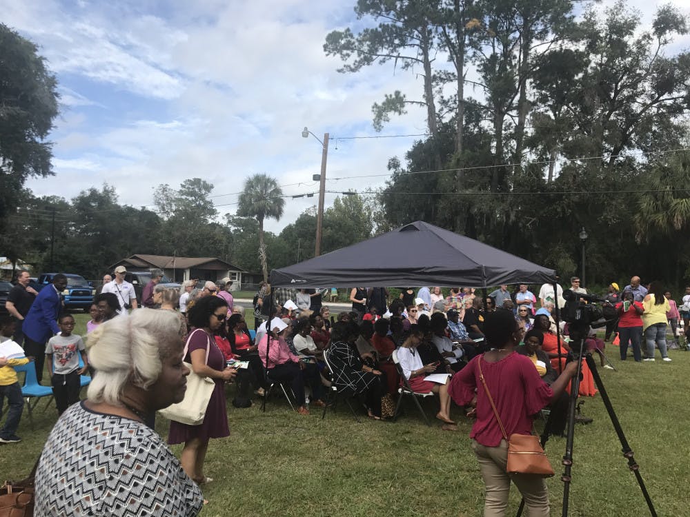 Writer's caption: Gainesville residents gather around the front of the restored Cotton Club Museum and Cultural Center for the ribbon-cutting ceremony.