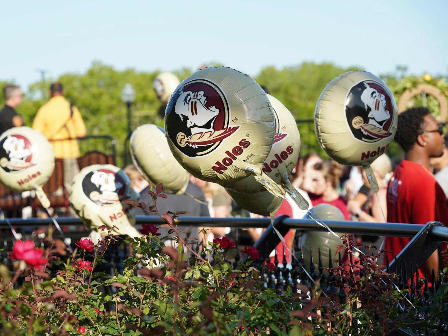 Balloons blow in the wind at vigil for mass shooting victims at Florida State University on Friday, April 18, 2025.