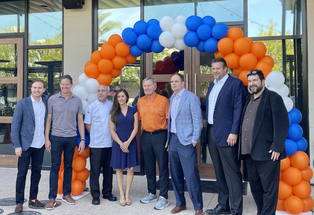 <p>Legendary Gator football coach Steve Spurrier gathered with family and staff to celebrate the opening of Spurrier&#x27;s Gridiron Grille. The restaurant, located at 4860 SW 31st Place, opened Aug. 11. </p>