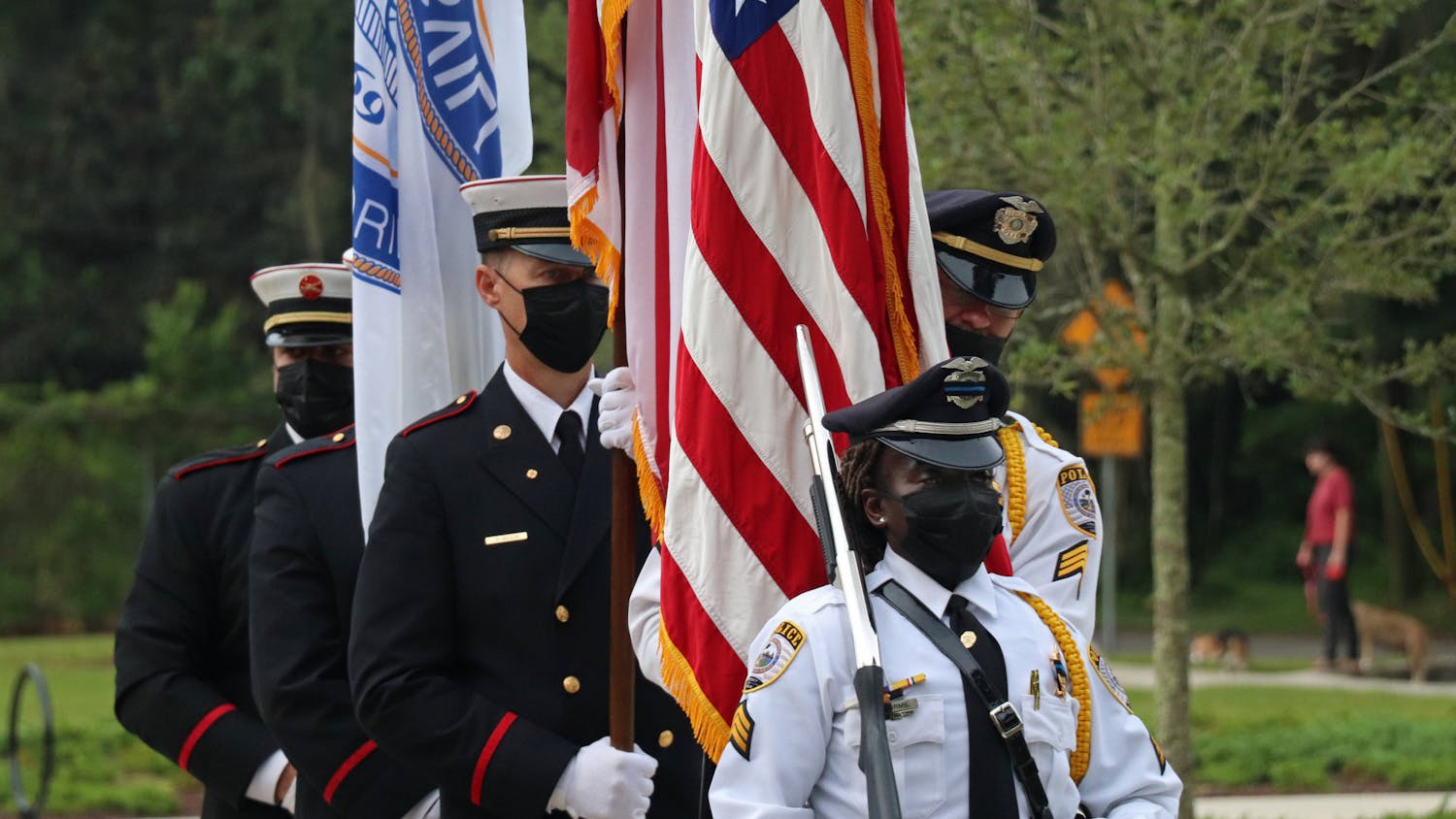 The Gainesville Fire Rescue and Gainesville Police Department joint honor guard does a presentation of colors at Reserve Park on Saturday, Sept. 11, 2021. The three flags represent the city, state and country (from left to right).