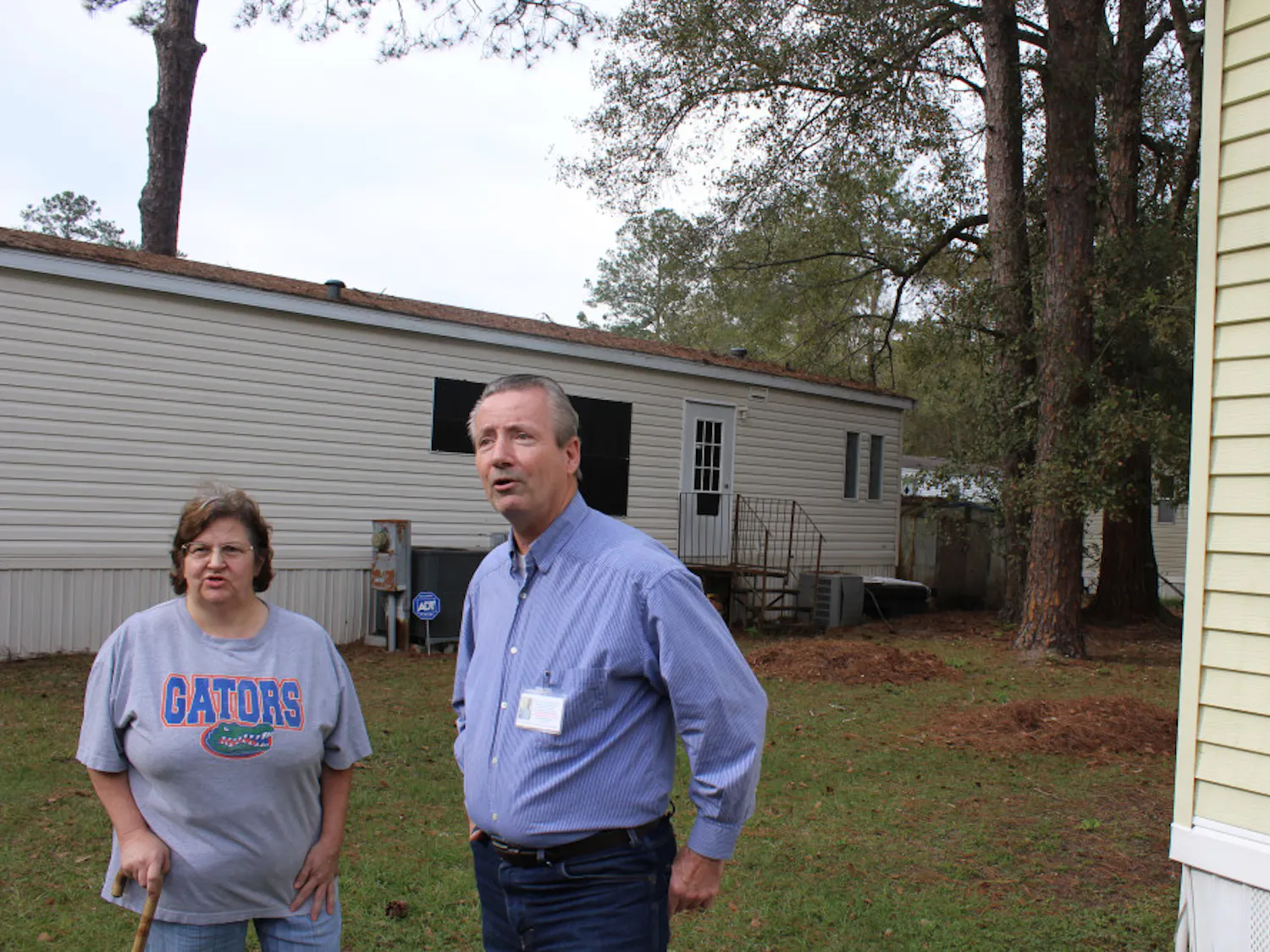 Gainesville mayoral candidate Donald Shepherd Sr. (right) and his wife, Nancy, speak outside his Gainesville home Wednesday afternoon. Gainesville Police say he stole a truck in August, and arrested him Wednesday morning.