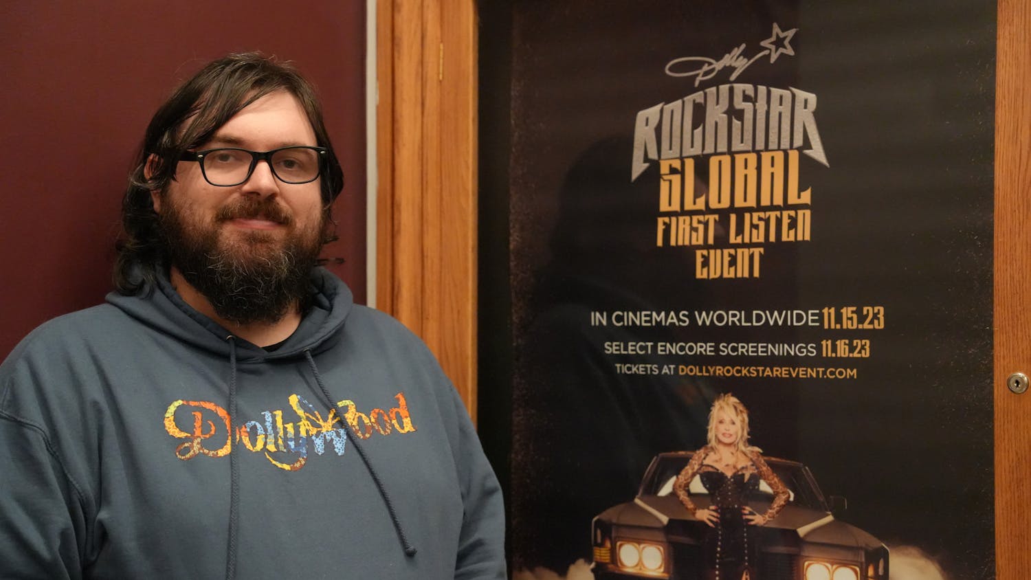 Matt Dibble, 33-year-old Hippodrome Theatre box office worker, sported his new Dollywood sweatshirt as he welcomed excited guests to the premiere Nov. 15, 2023 at The Hippodrome Theatre in Gainesville, Fla.
