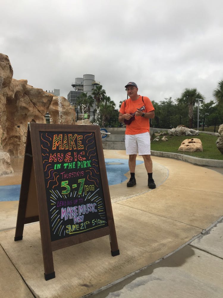Joe Dorsey, owner of Hoggtowne Music strums away at a previous Make Music Day.