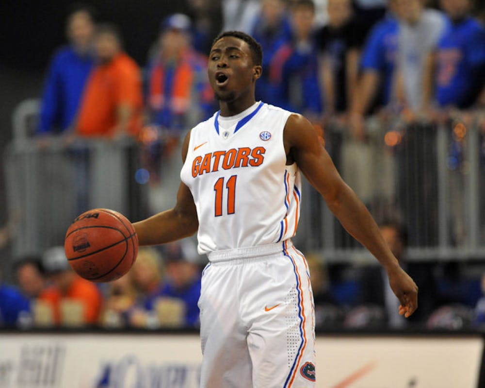 <p><span>Guard Braxton Ogbueze #11 of the Florida Gators controls the ball against the Vanderbilt Commodores March 6, 2013 at Stephen C. O'Connell Center in Gainesville, Florida. Ogbueze will transfer to UNC Charlotte, where he will play under 49ers coach Alan Major.&nbsp;</span></p>