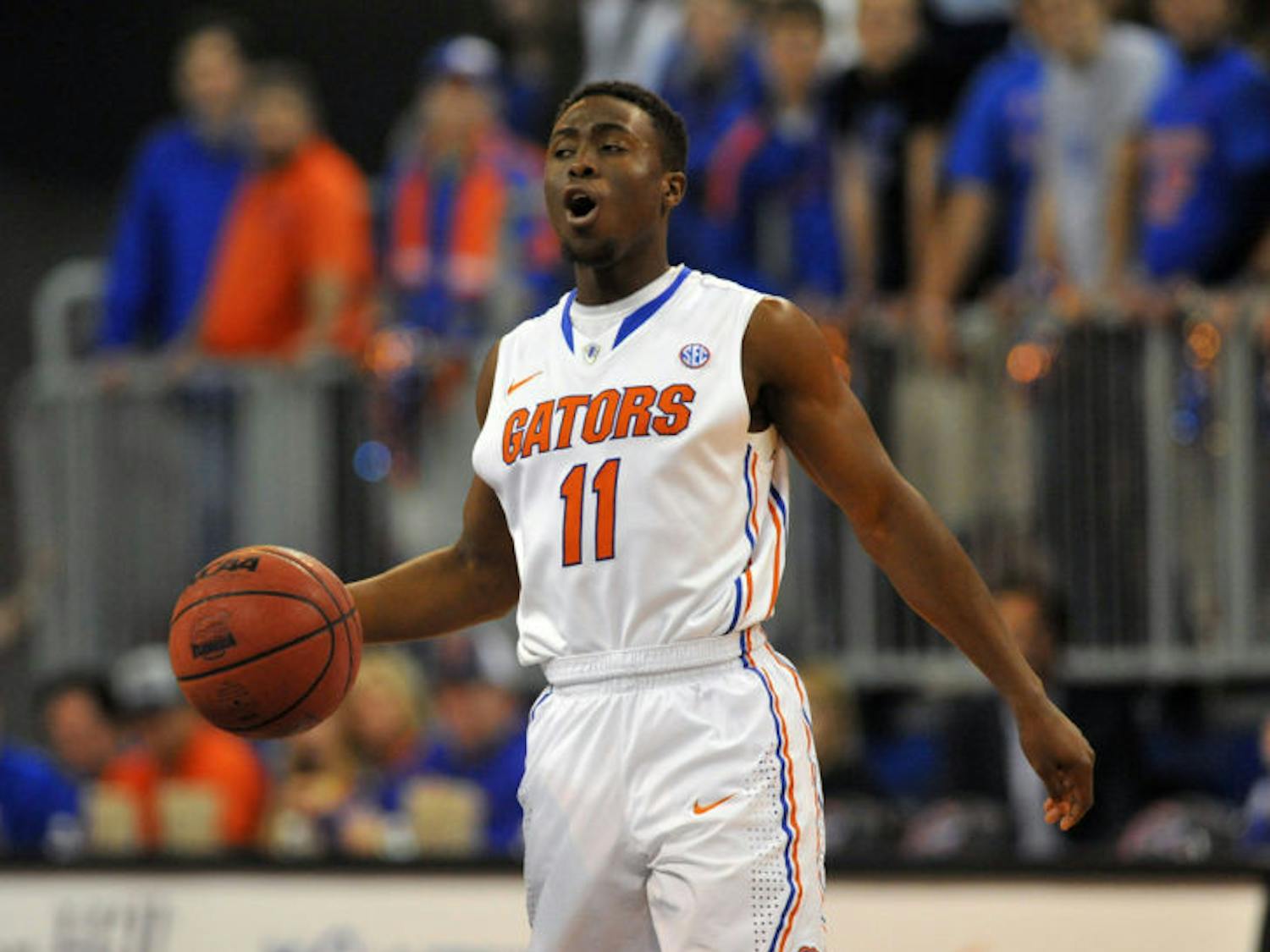 Guard Braxton Ogbueze #11 of the Florida Gators controls the ball against the Vanderbilt Commodores March 6, 2013 at Stephen C. O'Connell Center in Gainesville, Florida. Ogbueze will transfer to UNC Charlotte, where he will play under 49ers coach Alan Major. 