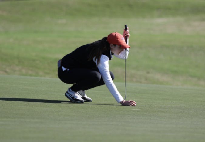 Maisie Filler lines up a putt at the Gator Invitational in February. 
