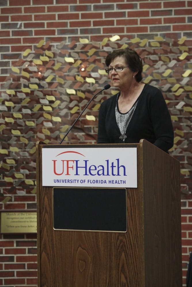 Lilly Rooks, a stroke survivor and former patient at UF Health Shands Hospital, addresses the crowd gathered at the celebration reception at UF Health Shands Hospital on Monday. 