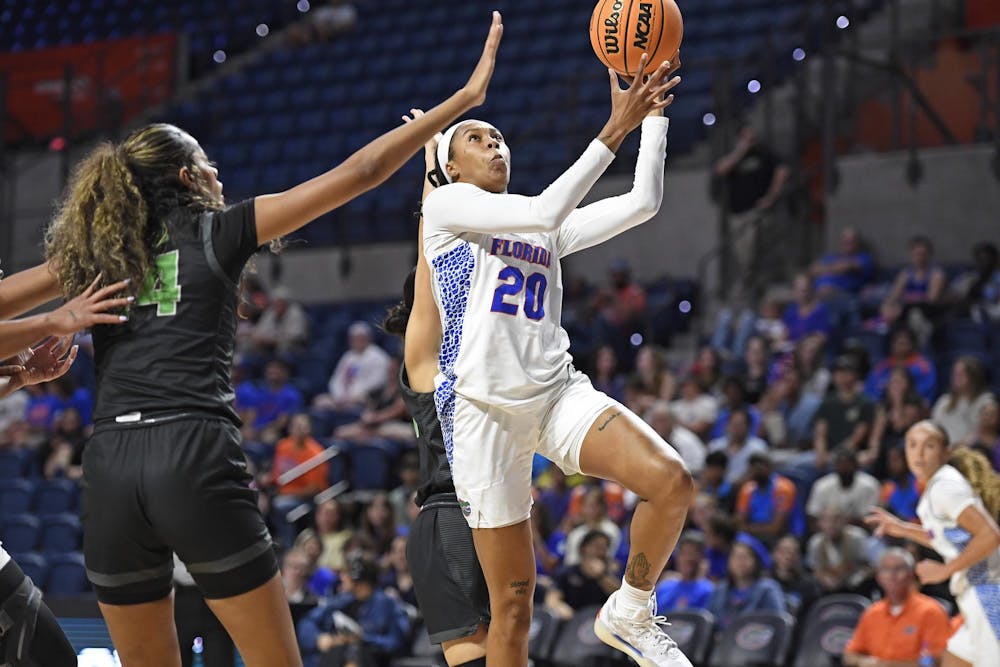 Jeriah Warren (20) drives to the rim during the first half against the Chicago State Cougars at Exactech Arena at the Stephen C. O'Connell Center on Tuesday, Nov. 12, 2024.