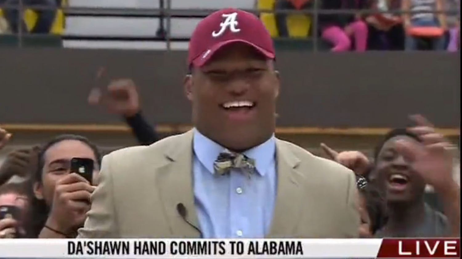 Da’Shawn Hand, the No. 1 recruit in the Class of 2014 according to Rivals.com, celebrates after committing to Alabama over Florida and Michigan on Thursday afternoon at a ceremony at Woodbridge (Va.) Senior High.