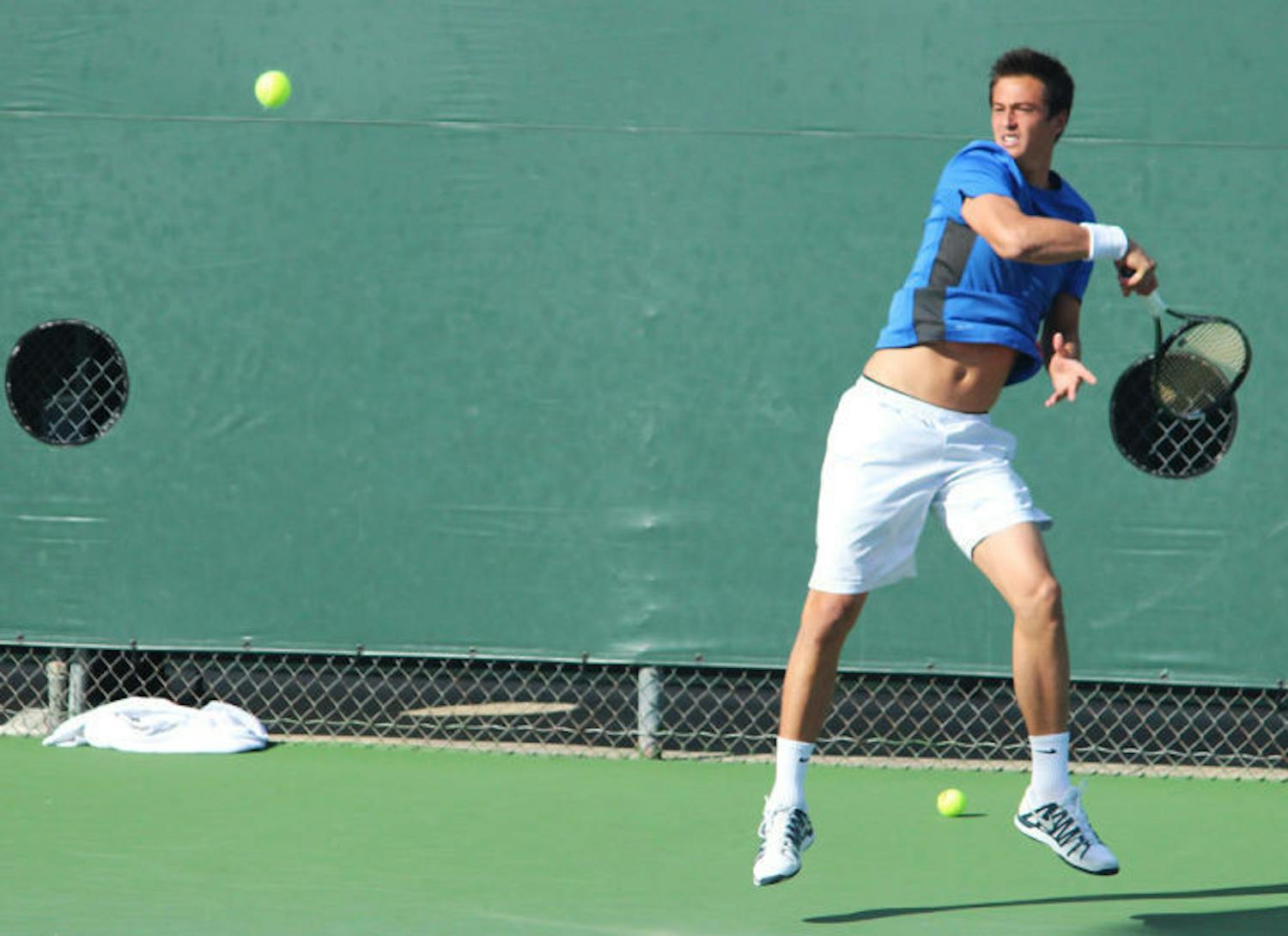 Florent Diep swings at the ball during Florida’s 4-2 win against TCU on Jan. 26 at the Ring Tennis Complex.