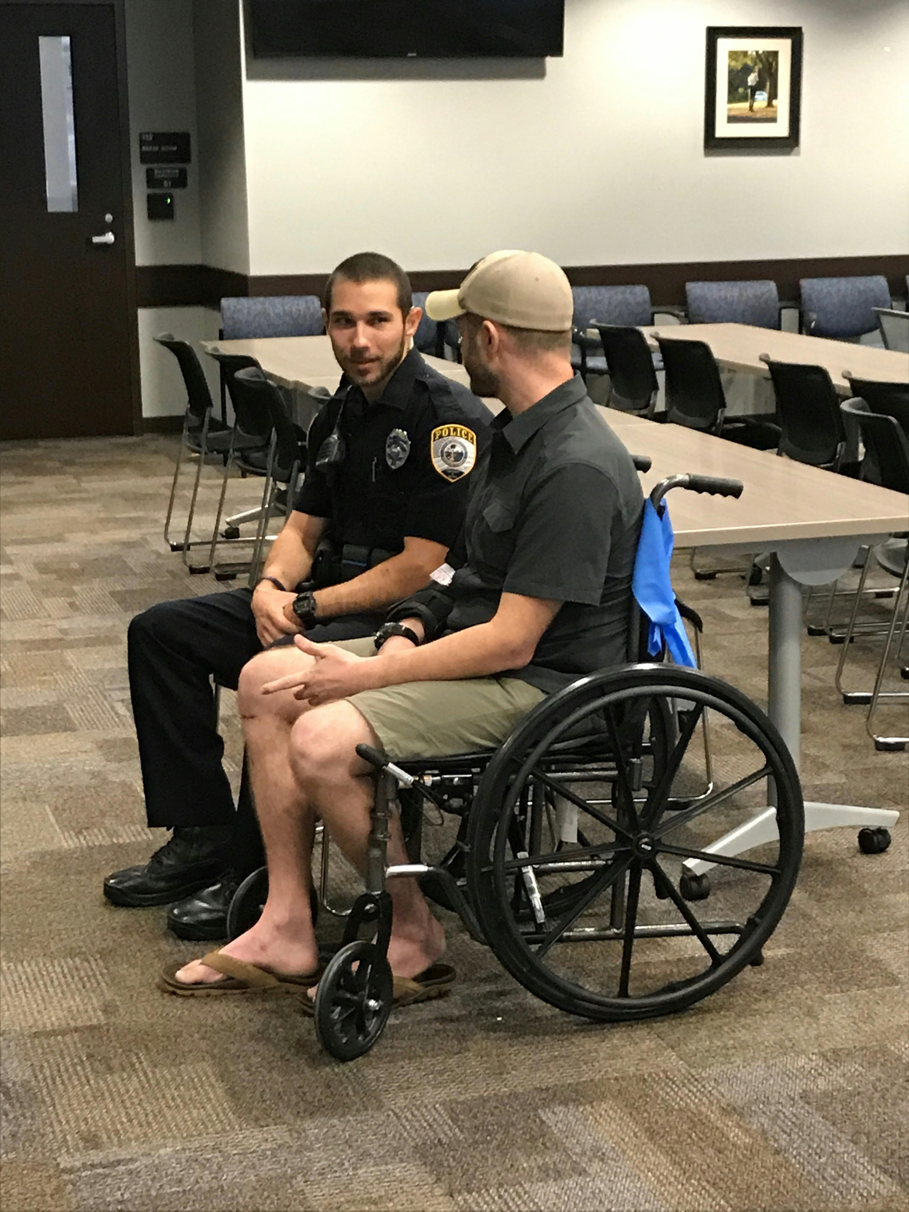 Joshua Roe, a 36-year-old UF doctoral student, and Gainesville Police officer Jack Salafrio meet on Thursday for the first time after Salafrio responded to a crash on Jan. 6 and rescued Roe. Roe was run over by his own car, which was stolen, police said. 