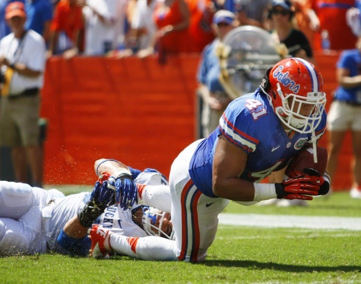 Fullback Hunter Joyer (41) falls forward after a catch during UF’s 38-0 win against Kentucky on Sept. 22 in Ben Hill Griffin Stadium. Joyer has been used primarily as a blocker, touching the ball only four times in 2012.&nbsp;