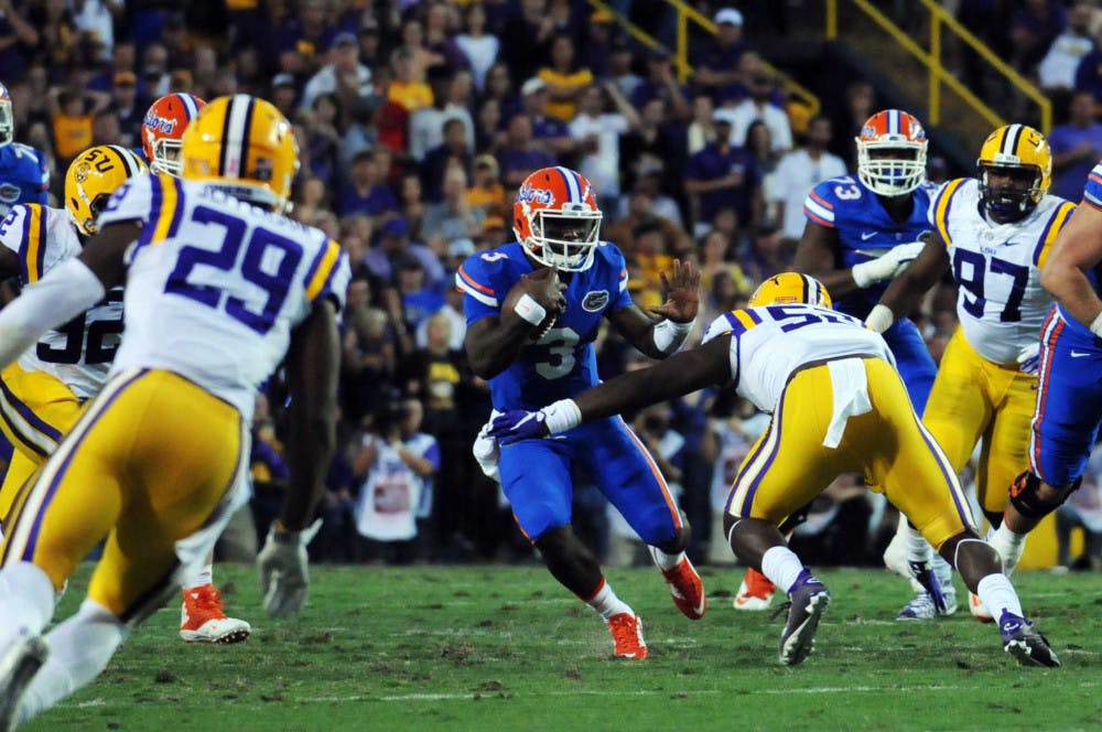 UF quarterback Treon Harris attempts to elude LSU linebacker Kendell Beckwith during Florida's 35-28 loss to LSU on Oct. 17, 2015, at Tiger Stadium in Baton Rouge, Louisiana.