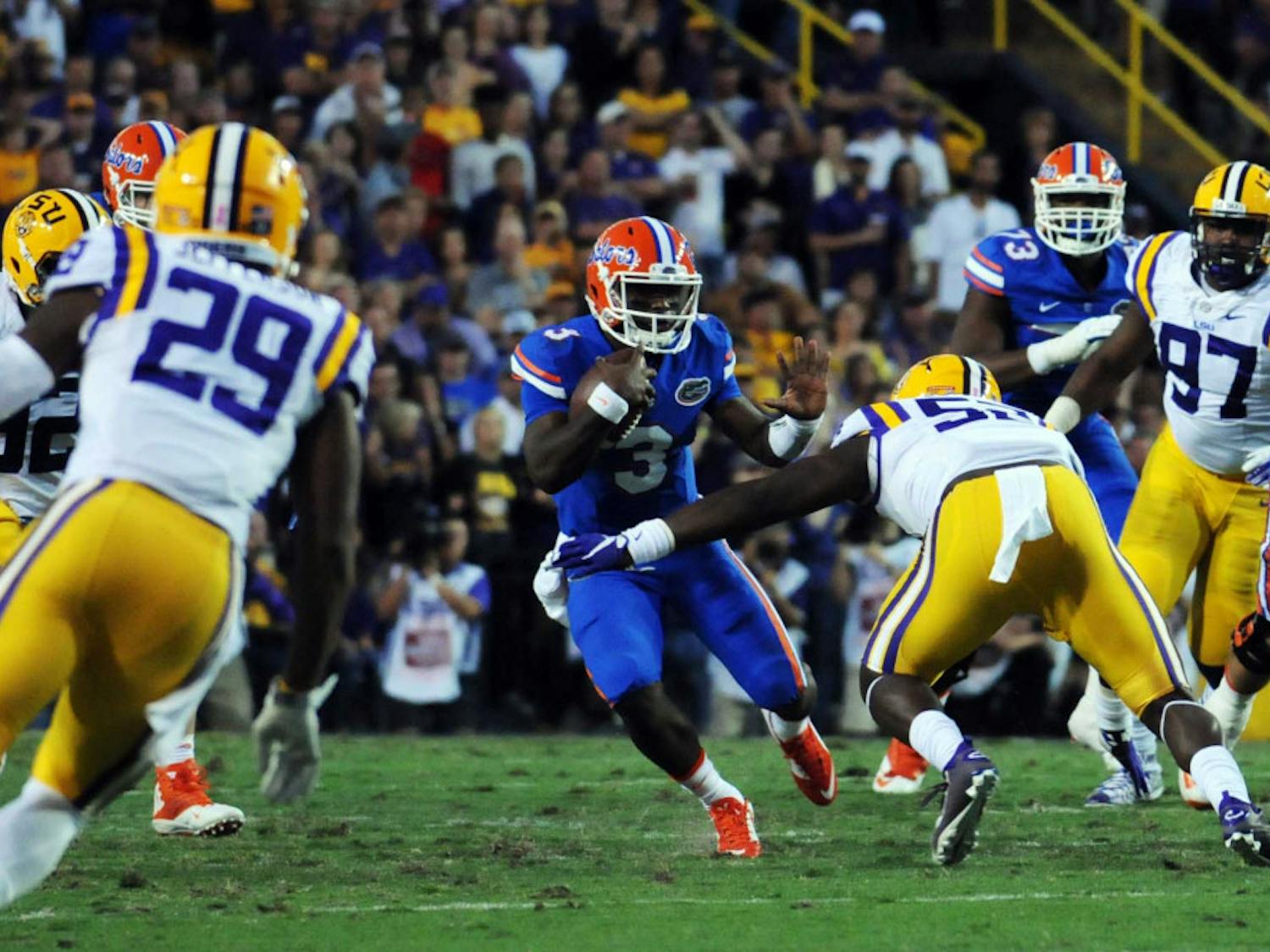 UF quarterback Treon Harris attempts to elude LSU linebacker Kendell Beckwith during Florida's 35-28 loss to LSU on Oct. 17, 2015, at Tiger Stadium in Baton Rouge, Louisiana.
