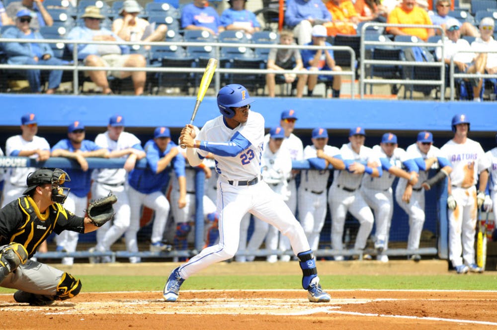 <p>Buddy Reed swings at a pitch during Florida's 7-5 win over Missouri on March 20, 2016, at McKethan Stadium.</p>