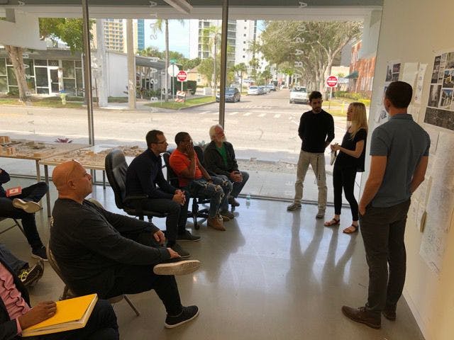 Students present their first concept proposals for the cultural arts center to a group of architects. From left to right: Larry Scarpa, Architect, Los Angeles; Damien Blumetti, Architect, Sarasota; Germane Barnes, Architect, Miami; Frank Sparkman, Architect, Tennessee; Pietro Mendanca, UF Architecture; Greta Crispen, UF Architecture; Frank Moore, UF Construction Management.