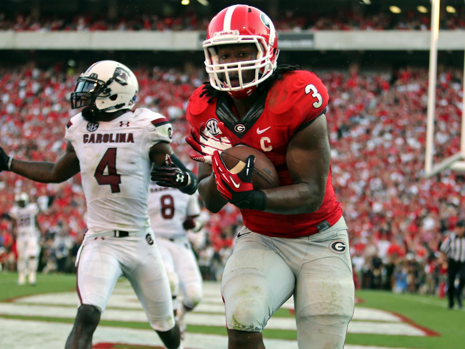 Georgia tailback Todd Gurley (3) makes an 8-yard touchdown reception from quarterback Aaron Murray in front of South Carolina defender Ahmad Christian (4) in Georgia's 41-30 win against South Carolina in Athens, Ga., on Sept. 7.