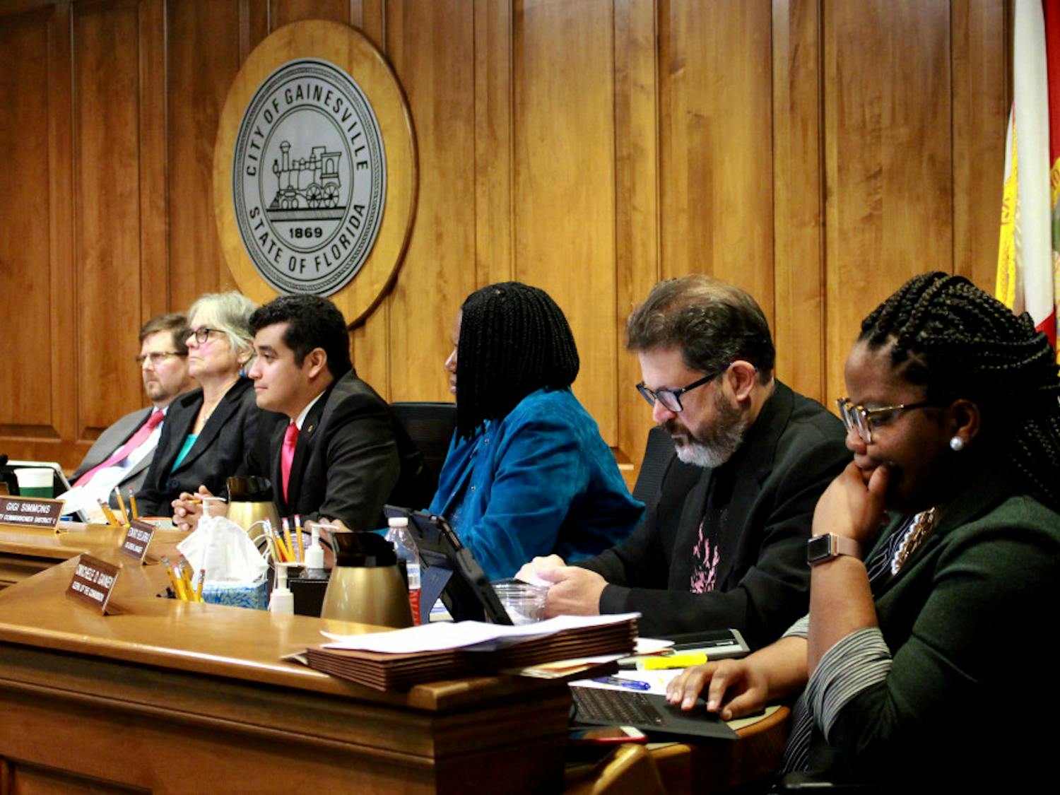 Mayor Lauren Poe, Gainesville city commissioners and city staff listen to the public’s comments Jan. 18, 2019, during the Gainesville City Commission meeting at City Hall. The meeting was over four hours long, and the panel of legislators passed legislation that banned the use of plastic bags in Gainesville. 