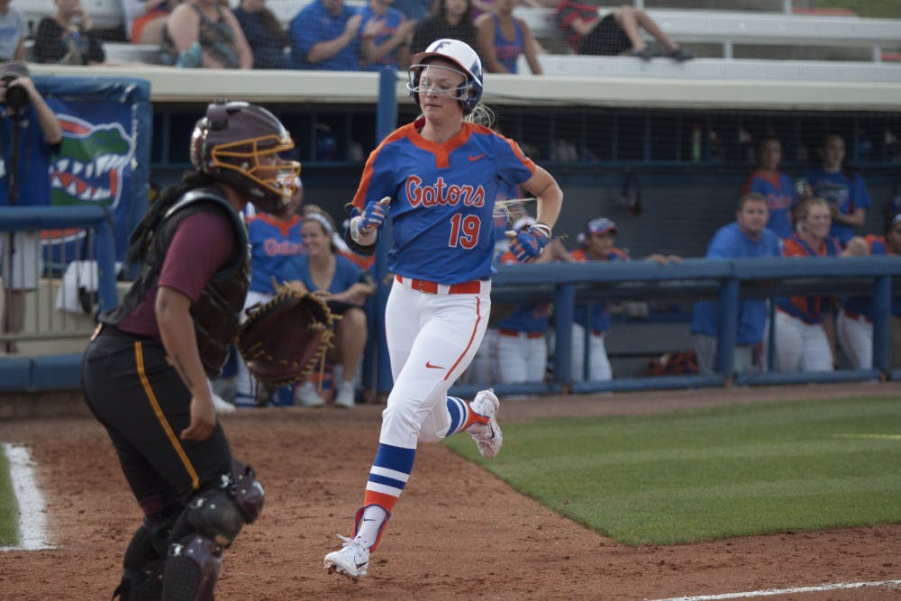 <p>UF outfielder Chelsea Herndon scores a run during Florida's 15-7 win against Bethune-Cookman on March 29, 2017, at Katie Seashole Pressly Stadium.</p>