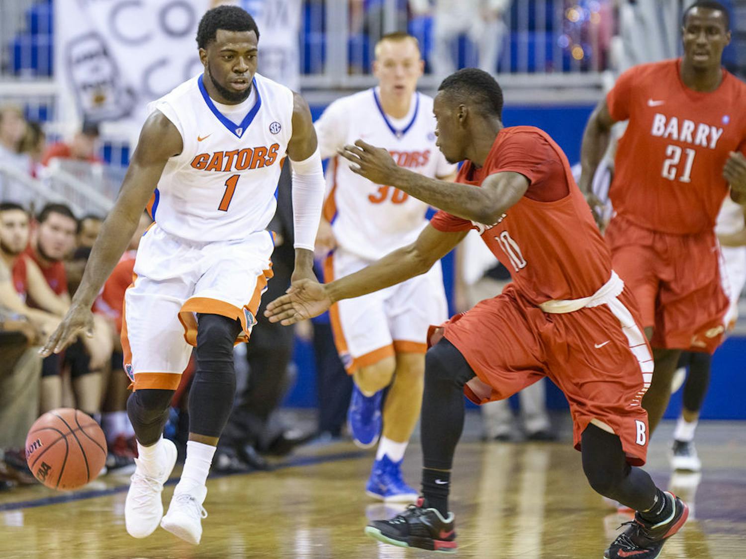 Eli Carter dribbles the ball down the court during Florida's 79-70 win against Barry in an exhibition game on Thursday in the O'Connell Center.