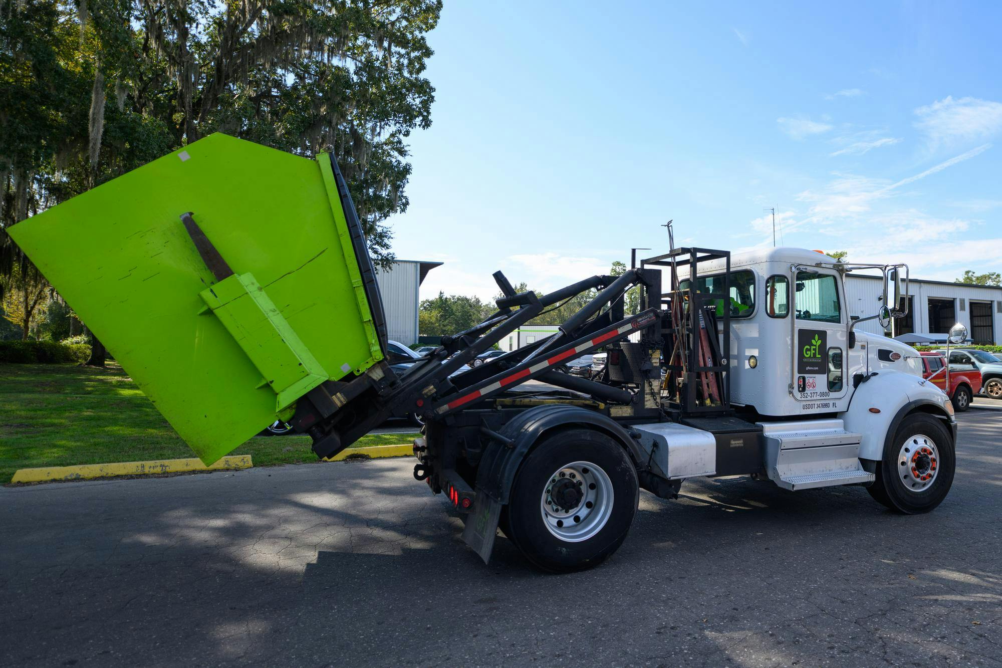 A truck hauling a garbage dumpster arrives to GFL's dumping facility on Tuesday, Sept. 29, 2026, in Gainesville, Fla.