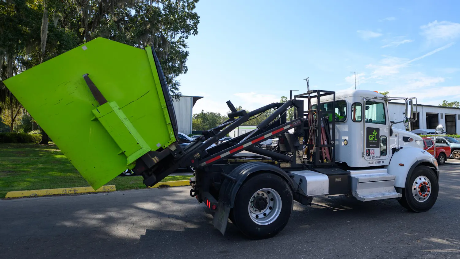 A truck hauling a garbage dumpster arrives to GFL's dumping facility on Tuesday, Sept. 29, 2026, in Gainesville, Fla.