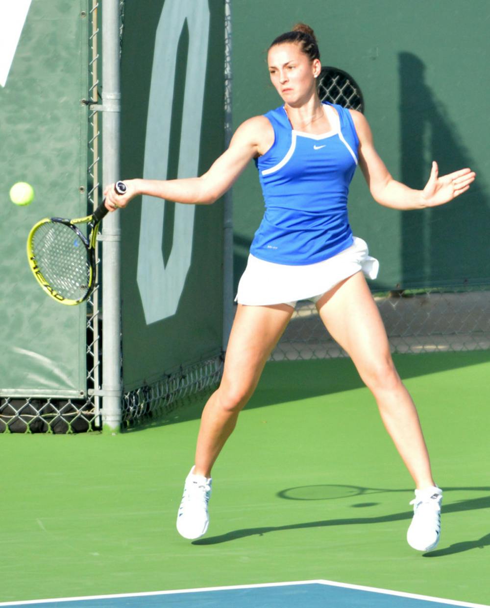 <p>Sofie Oyen returns a ball during Florida’s 7-0 win against Florida State on Feb. 18 at the Ring Tennis Complex.</p>