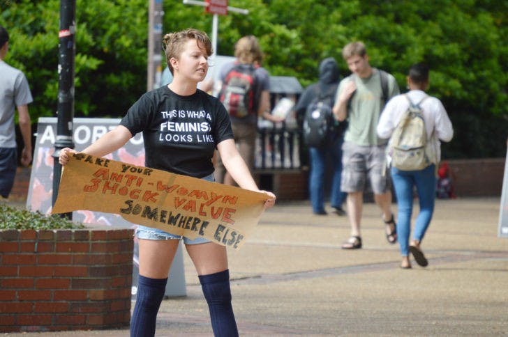 Anna Cesarotti, a 20-year-old UF sociology student, protests against graphic posters of aborted fetuses that were displayed on Turlington Plaza on Tuesday afternoon. The posters are displayed yearly by anti-abortion group Created Equal.