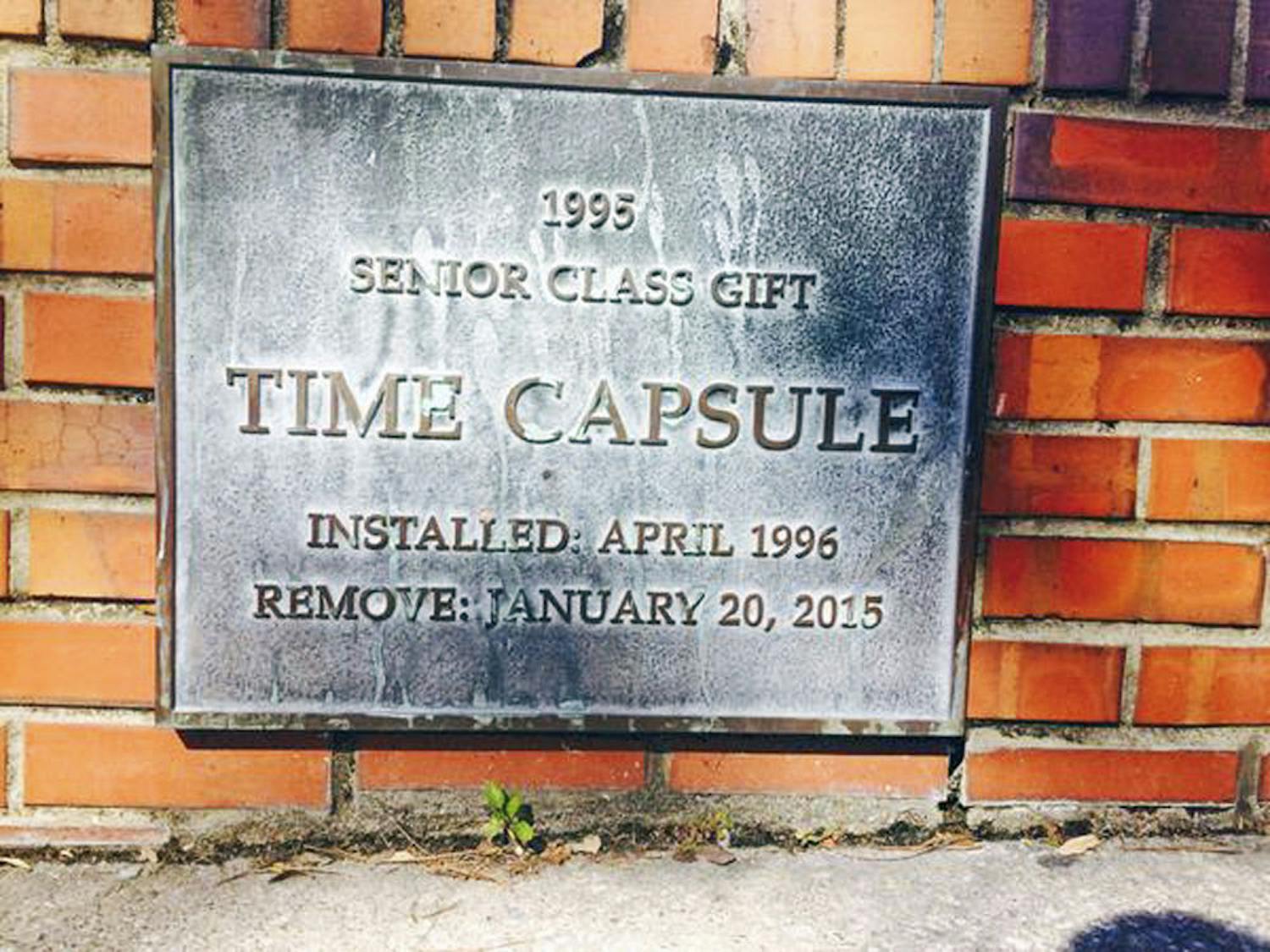 A photo of the plaque covering the time capsule installed near the Florida Gym. The opening of the capsule was delayed until April to coincide with the UF Class of 1995’s reunion.