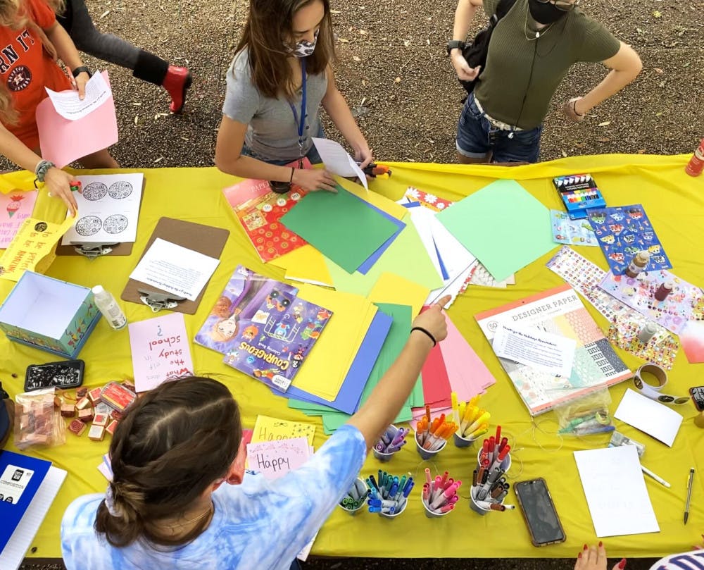 A picture of people creating holiday cards