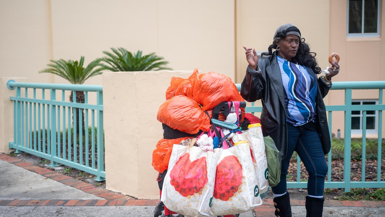 AD Hunter, a Gainesville local, stands outside the Alachua County Main Library downtown, Saturday, Feb. 28, 2026.