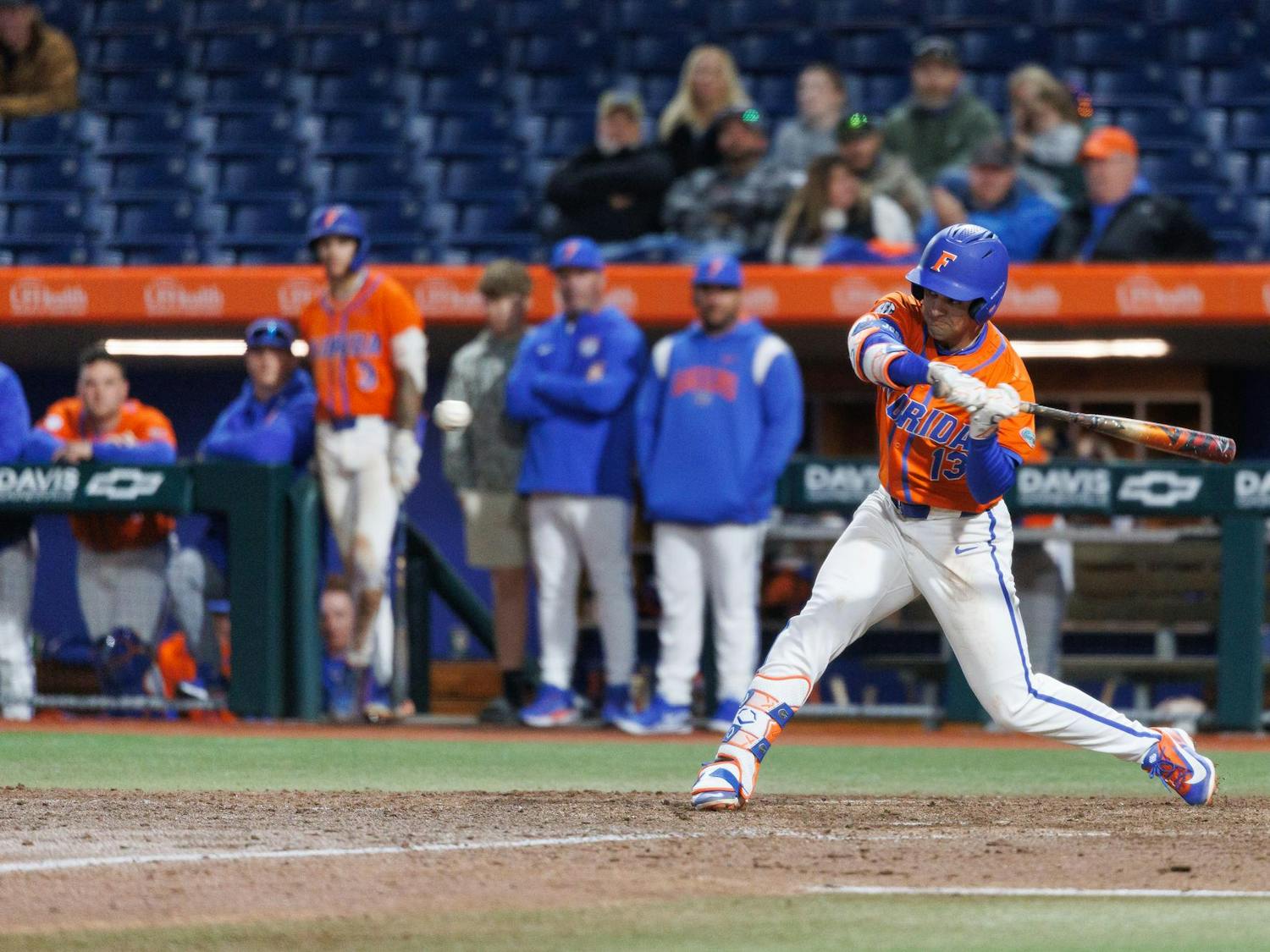 Florida infielder Landon Stripling (13) swings his bat during an NCAA baseball game against Florida International University, Wednesday, Feb. 25, 2026, in Gainesville, Fla.