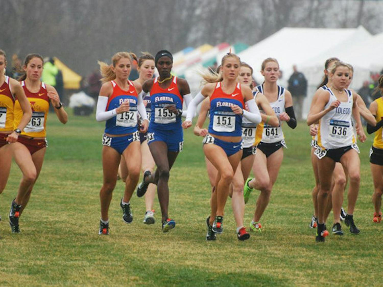 Florida distance runner Genevieve LaCaze (151) runs with team members Florence N’Getich (153) and Cory McGee (152) during the NCAA Championship race on Nov. 21. LaCaze finished in 42nd place and posted the second best time for a Gator since 1997.